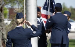 Soldiers Saluting Flag in Honor